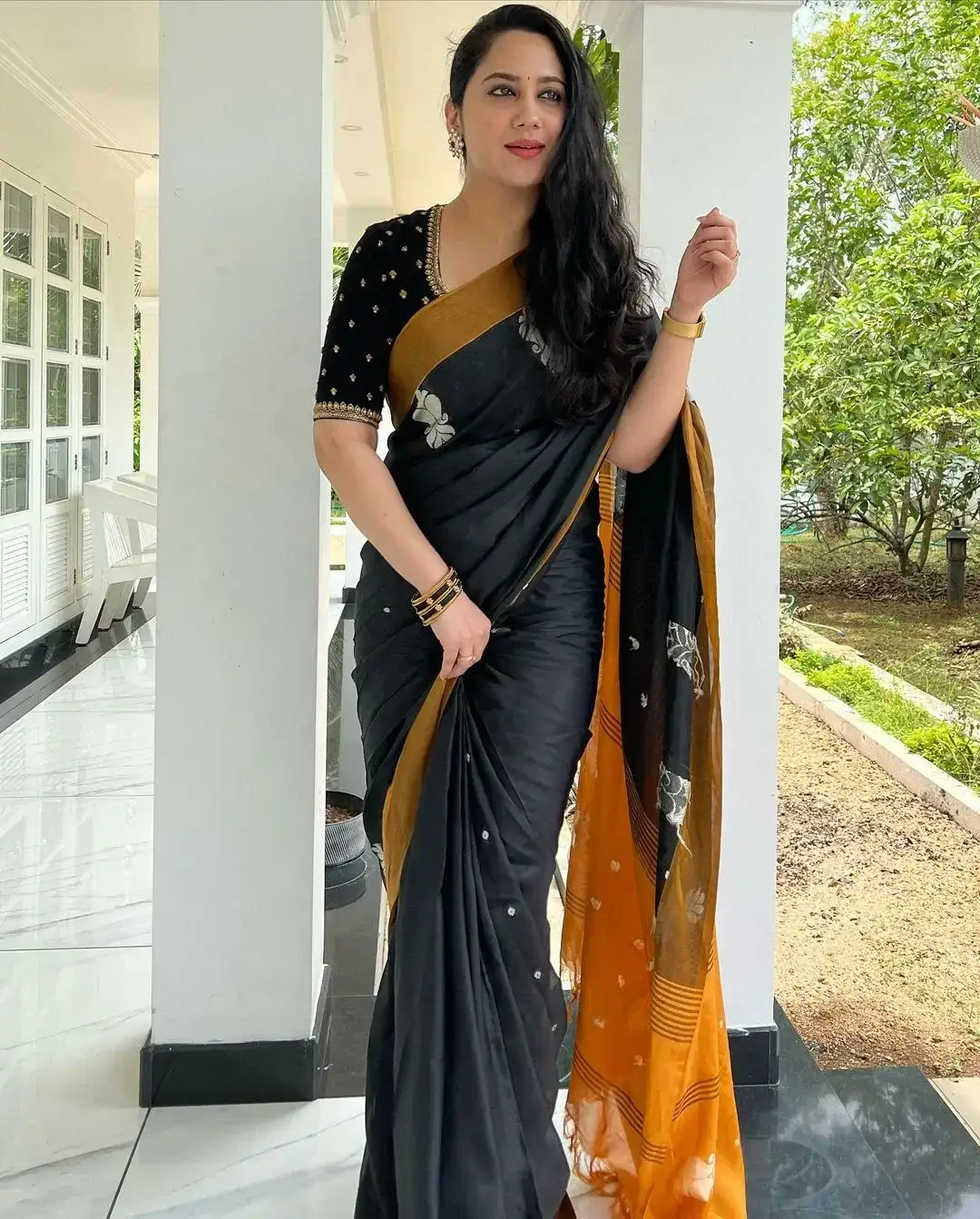 Beautiful Indian Queen Miya George in Traditional black Saree